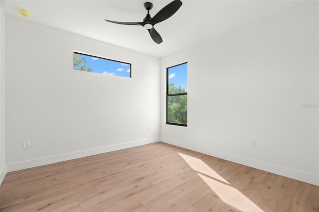 empty room featuring ceiling fan and light hardwood / wood-style flooring