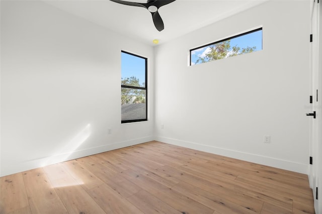 unfurnished room with light wood-type flooring and ceiling fan