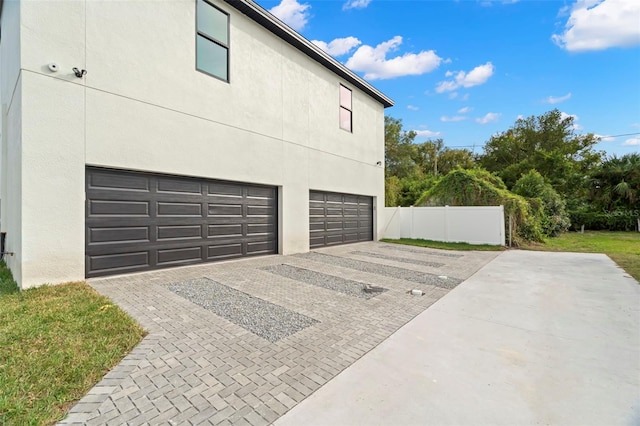 view of side of home featuring a garage