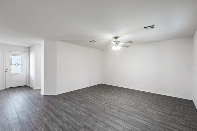 unfurnished room featuring ceiling fan and dark hardwood / wood-style floors