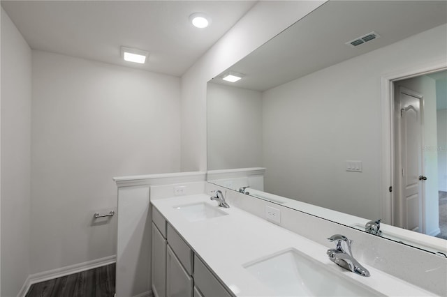 bathroom featuring vanity and hardwood / wood-style flooring