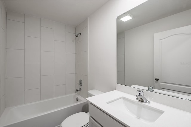 full bathroom featuring toilet, vanity, and tiled shower / bath combo