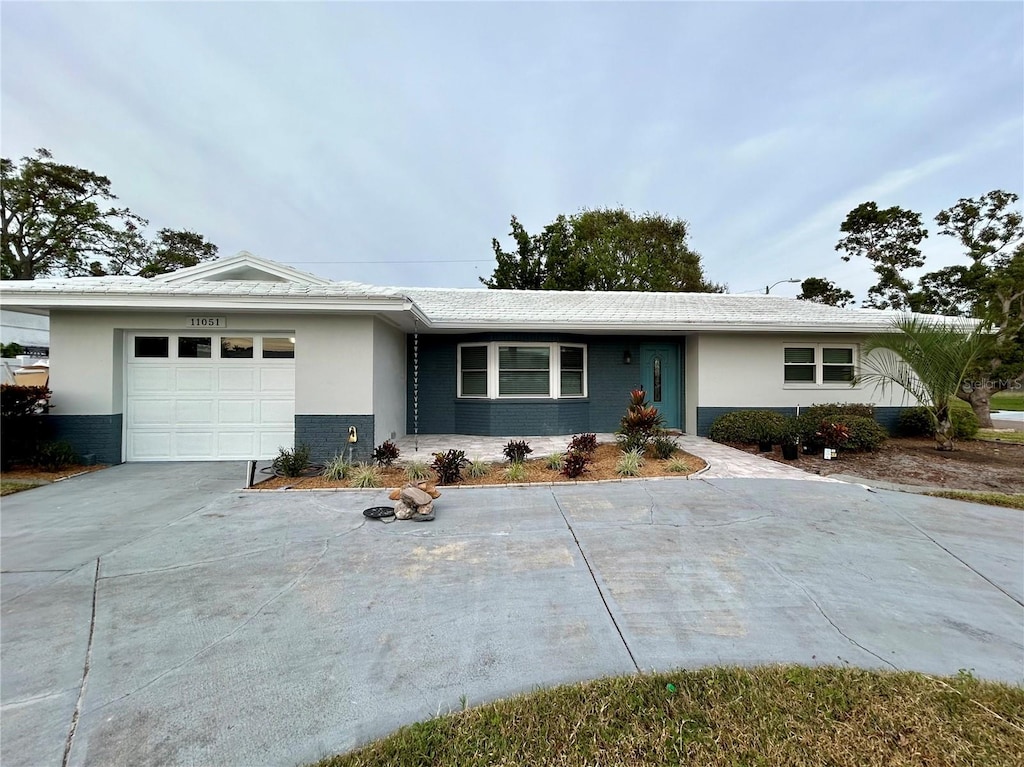 single story home with a garage