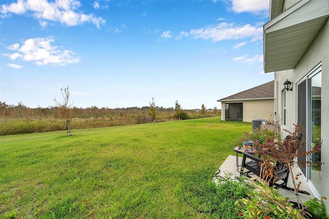 view of yard with a rural view