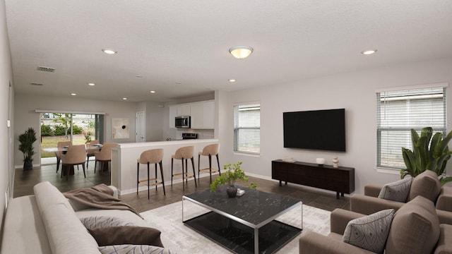 living room with a textured ceiling