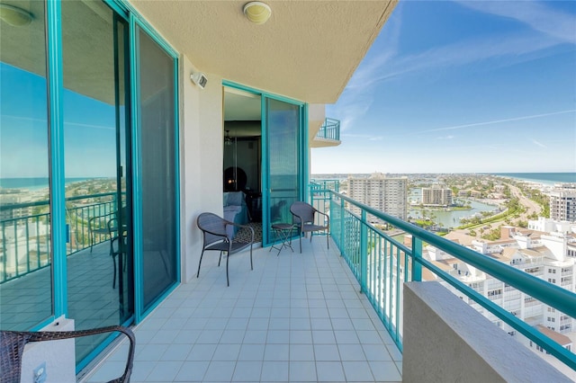 balcony featuring a water view