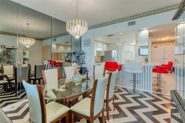 dining space featuring crown molding and a chandelier