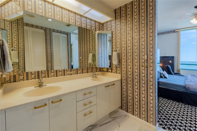 bathroom featuring vanity and a textured ceiling