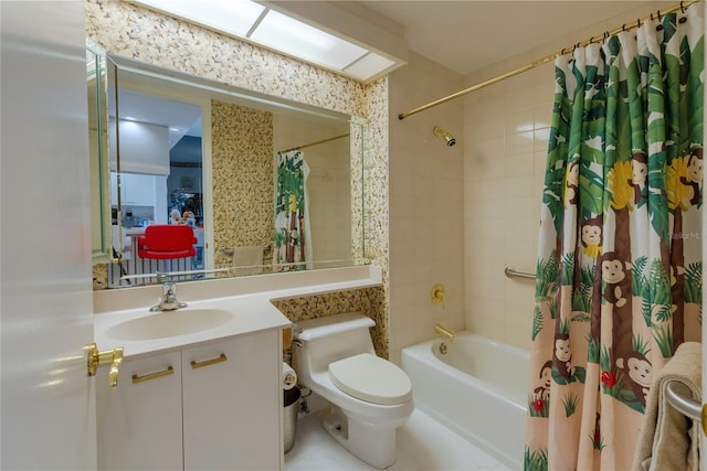 full bathroom with tile patterned flooring, vanity, toilet, and shower / bath combo with shower curtain