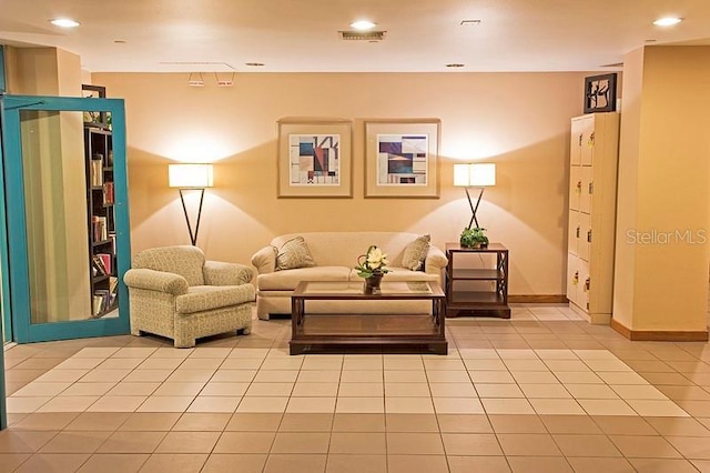 living area featuring light tile patterned flooring