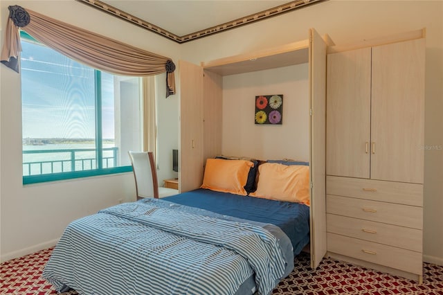 bedroom featuring carpet floors and multiple windows