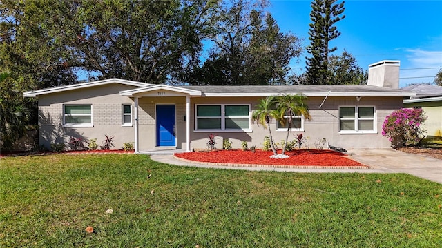 single story home with a front yard