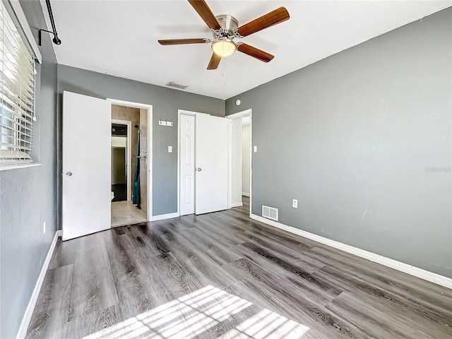 unfurnished bedroom with hardwood / wood-style flooring and ceiling fan