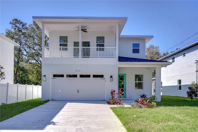 view of front of property featuring a garage and a front lawn