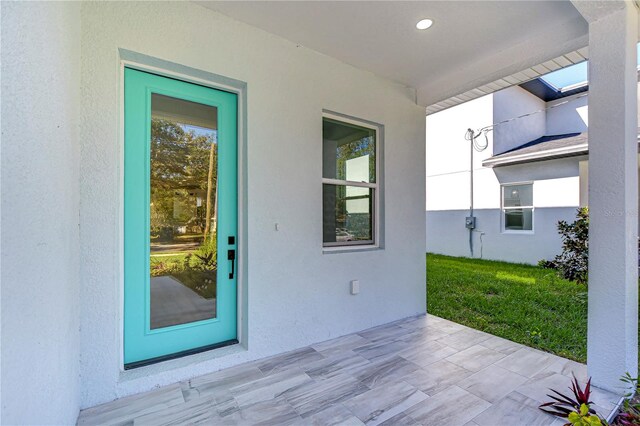 property entrance with covered porch