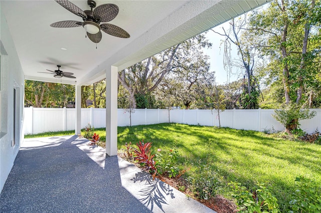 view of patio featuring ceiling fan