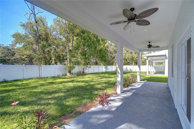 view of yard featuring ceiling fan