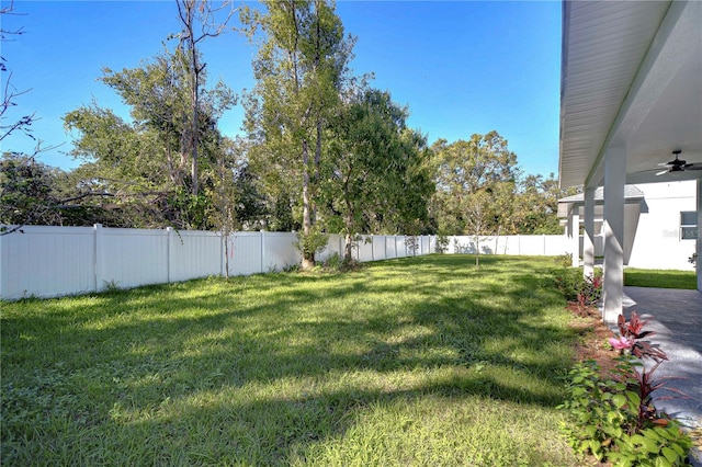 view of yard featuring ceiling fan