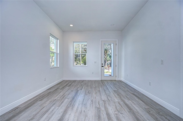 unfurnished room featuring light wood-type flooring