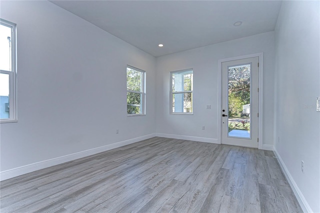 spare room with light hardwood / wood-style floors