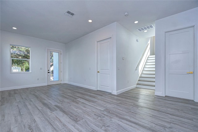 unfurnished living room with light wood-type flooring