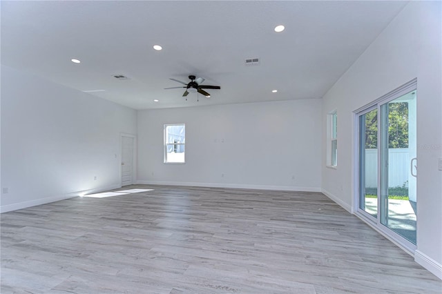 unfurnished room featuring light wood-type flooring and ceiling fan