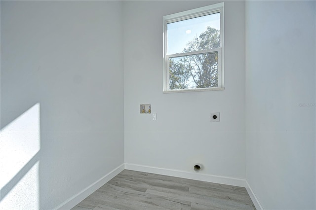 laundry area with washer hookup, electric dryer hookup, and light wood-type flooring