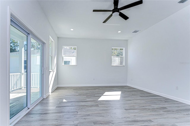 empty room featuring light wood-type flooring and ceiling fan