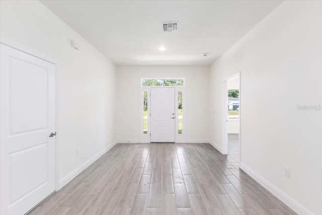 entrance foyer featuring light hardwood / wood-style floors