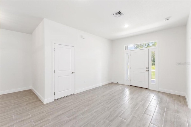 foyer with light hardwood / wood-style flooring