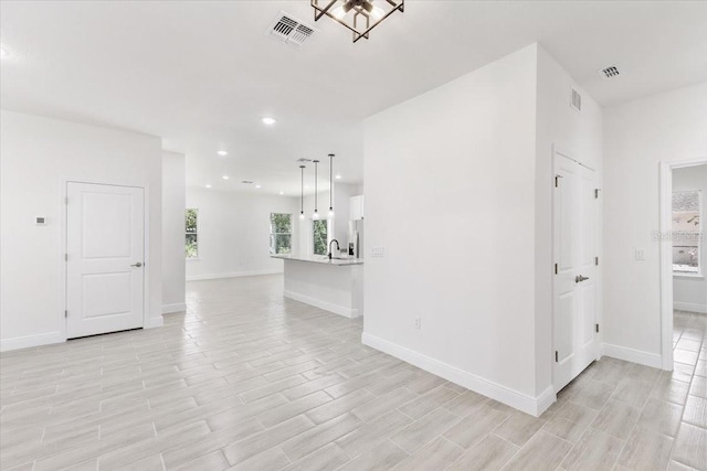 spare room featuring light hardwood / wood-style flooring