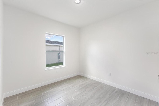 spare room with light hardwood / wood-style flooring