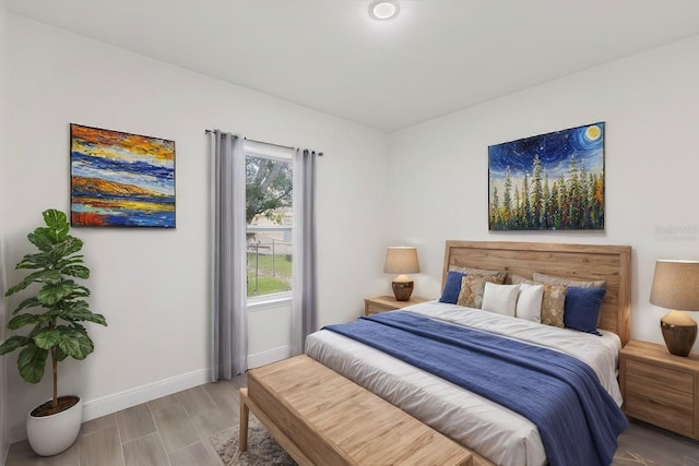 bedroom with hardwood / wood-style floors