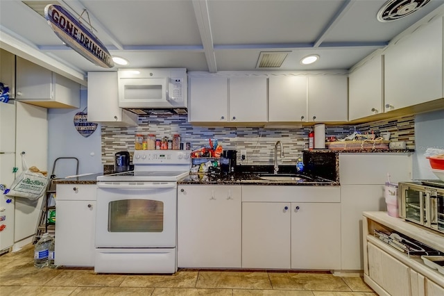 kitchen featuring light tile patterned floors, white appliances, white cabinetry, and sink