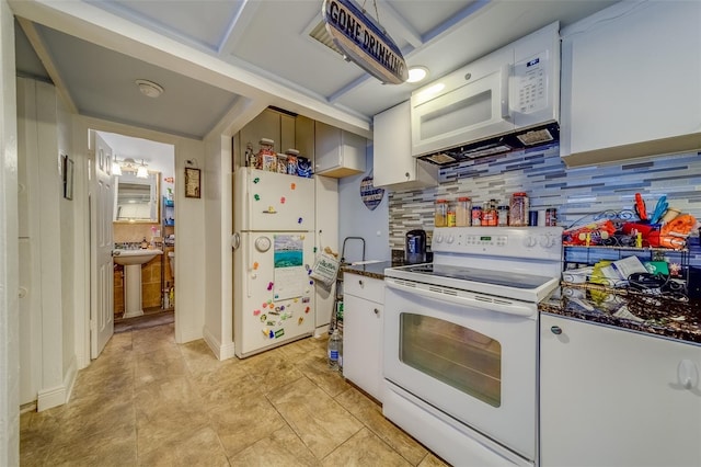 kitchen with white appliances, white cabinets, sink, decorative backsplash, and light tile patterned flooring