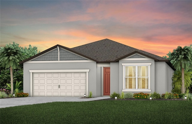 view of front of home featuring a garage and a lawn