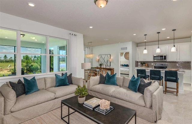 living room with light tile patterned flooring