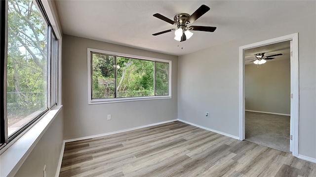 unfurnished bedroom with ceiling fan and light hardwood / wood-style floors