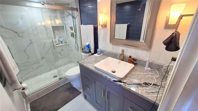 bathroom featuring vanity, toilet, and walk in shower