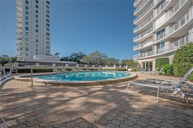 view of swimming pool featuring a patio area