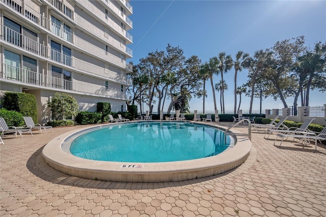 view of swimming pool with a patio