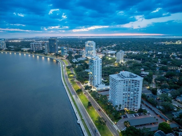 aerial view at dusk with a water view