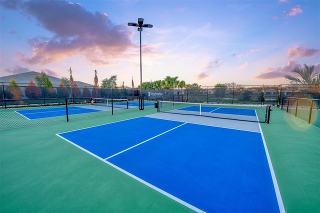 view of sport court with basketball hoop