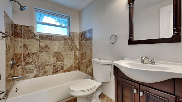 full bathroom featuring vanity, tiled shower / bath combo, and toilet