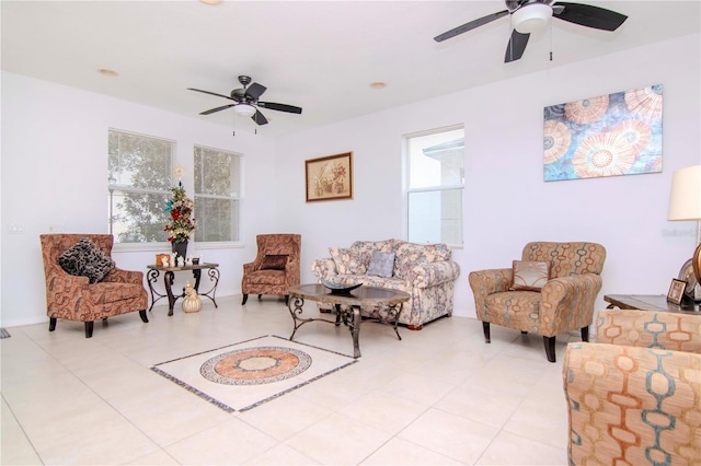 tiled living room with ceiling fan