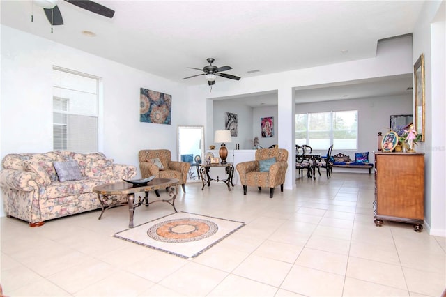 living room with ceiling fan and light tile patterned flooring