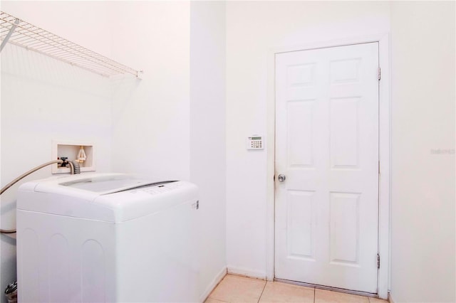 washroom featuring light tile patterned floors and washer / clothes dryer