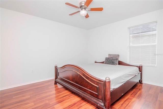 bedroom featuring ceiling fan and hardwood / wood-style flooring