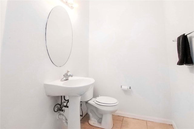 bathroom featuring tile patterned floors and toilet