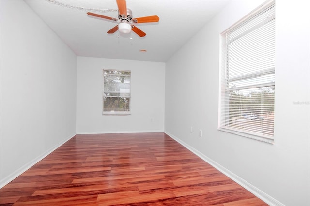 spare room with ceiling fan and hardwood / wood-style floors